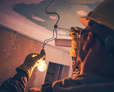 Electrician wiring light.