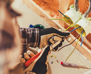 Electrician working on wiring.